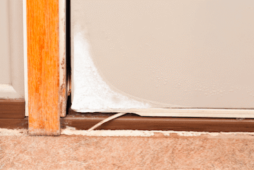 A small gap in a door letting air in