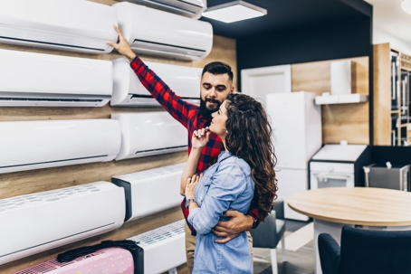 couple looking at heat pumps